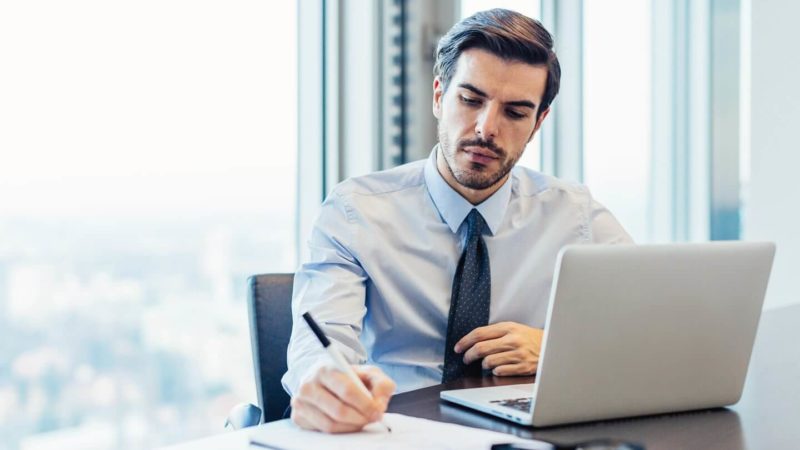 Man working at his desk on his laptop