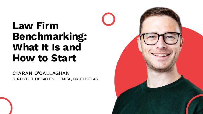 Brightflag's Director of Sales - EMEA, in glasses and a green shirt, smiling in front of a white and red background, with the title 