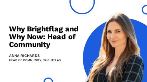 Brightflag's Head of Community, Anna Richards, smiling in a business suit with her arms folded in front of a white and blue background, with the text 