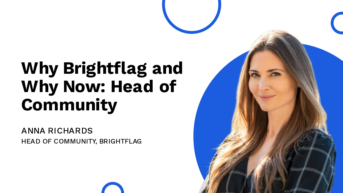 Brightflag's Head of Community, Anna Richards, smiling in a business suit with her arms folded in front of a white and blue background, with the text 